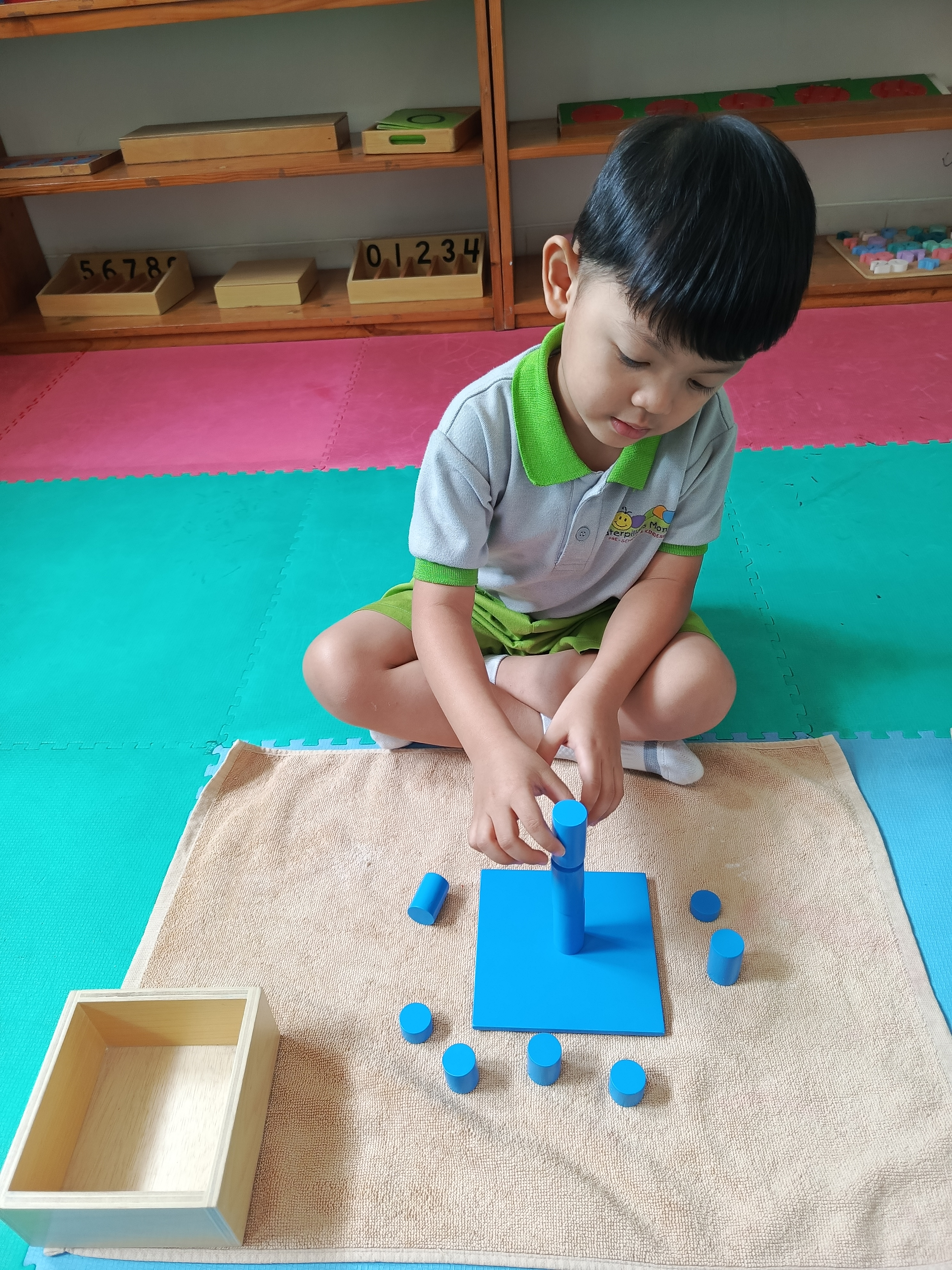 Children doing hands-on Montessori work